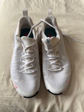 Nike White Sneakers with Pink Swoosh Accents